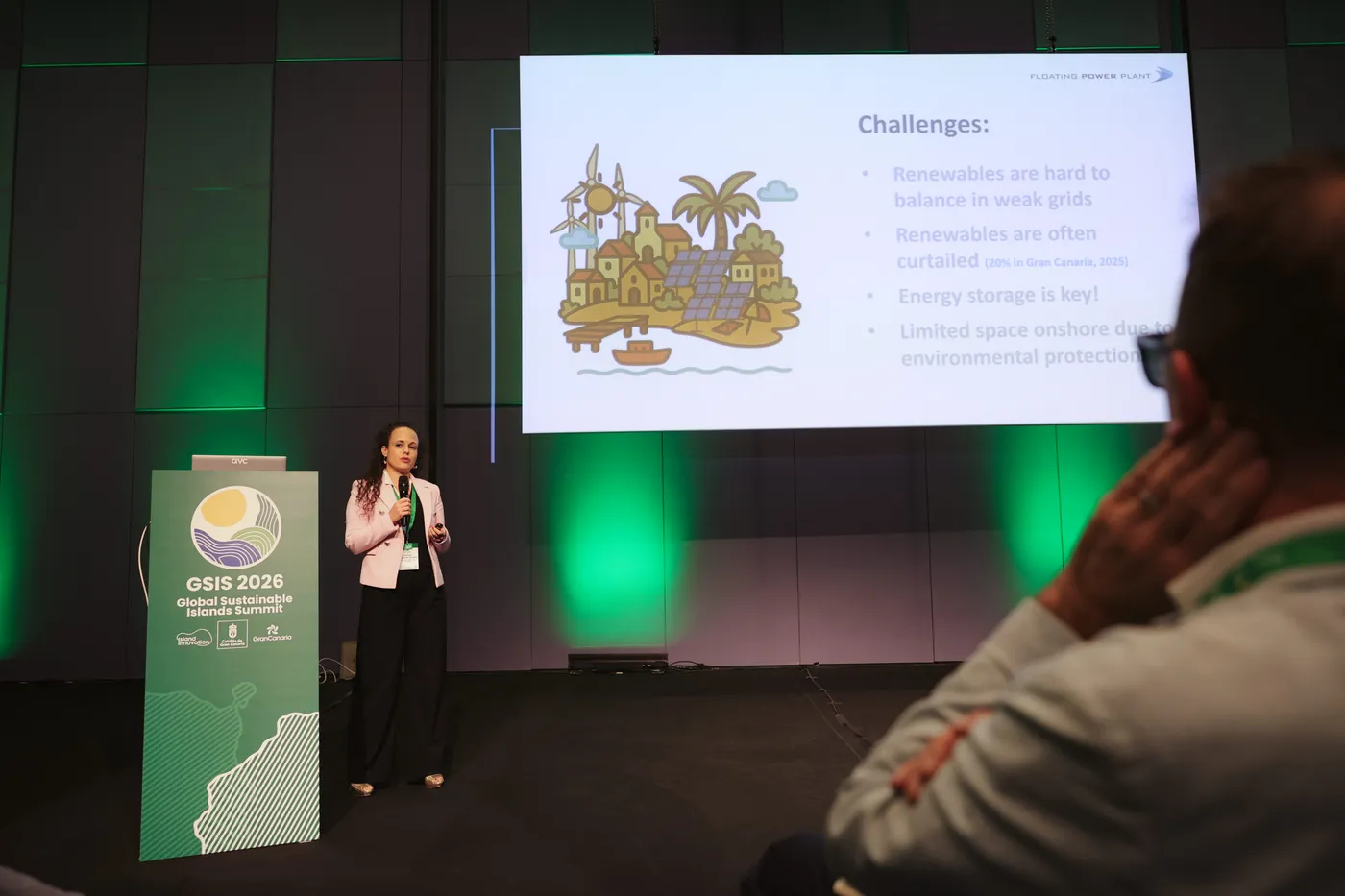 A speaker presents an energy challenges slide at the GSIS 2026 podium during the Energy and Circularity track of the Solutions Showcase, Gran Canaria